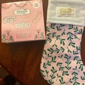 Set of cozy socks a sleep mask and a headband